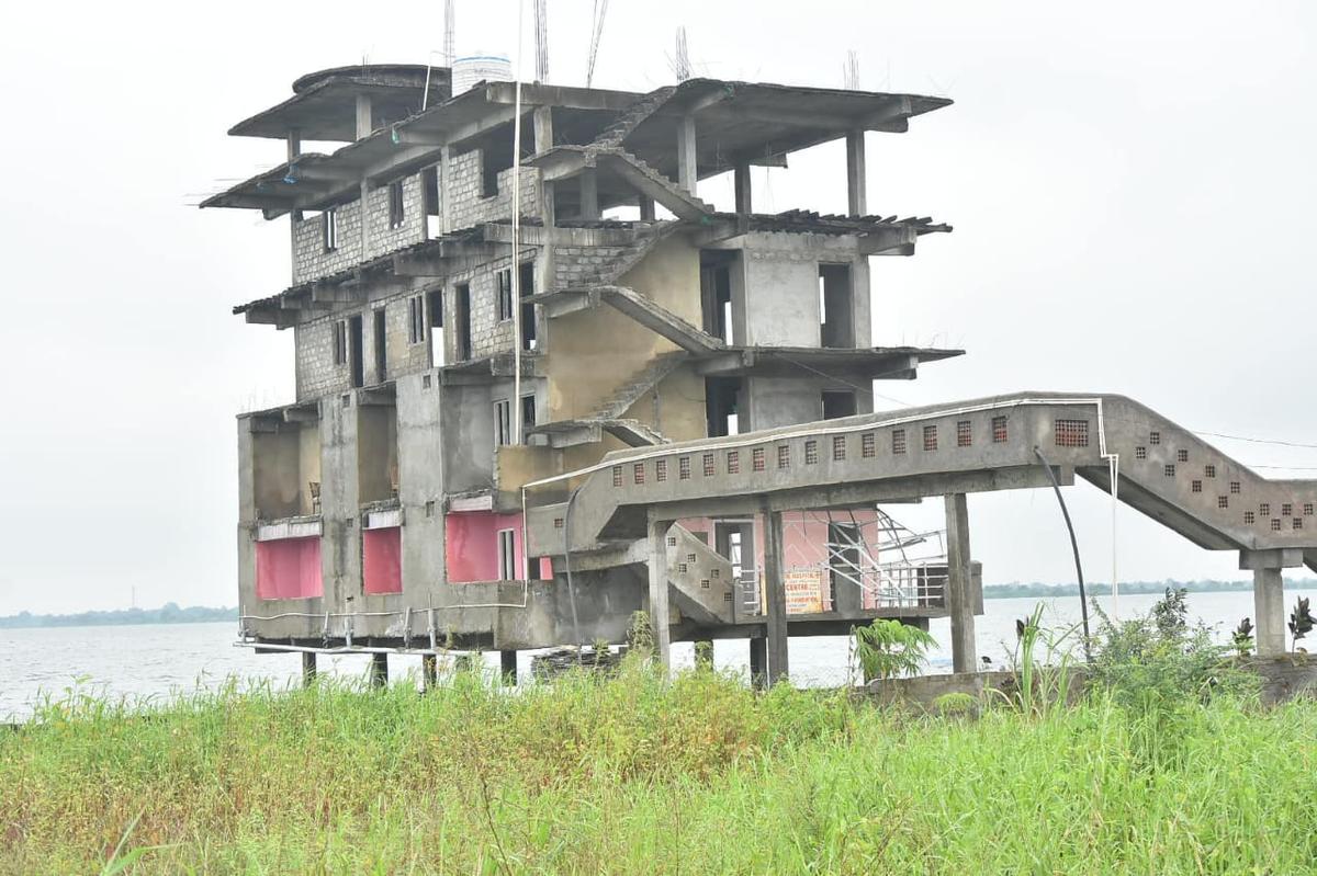 Image of the four-storeyed building built into the Malkapur Pedda cheruvu, Kondapur Mandal, Sangareddy district, before it was razed on Thursday (September 26, 2024).