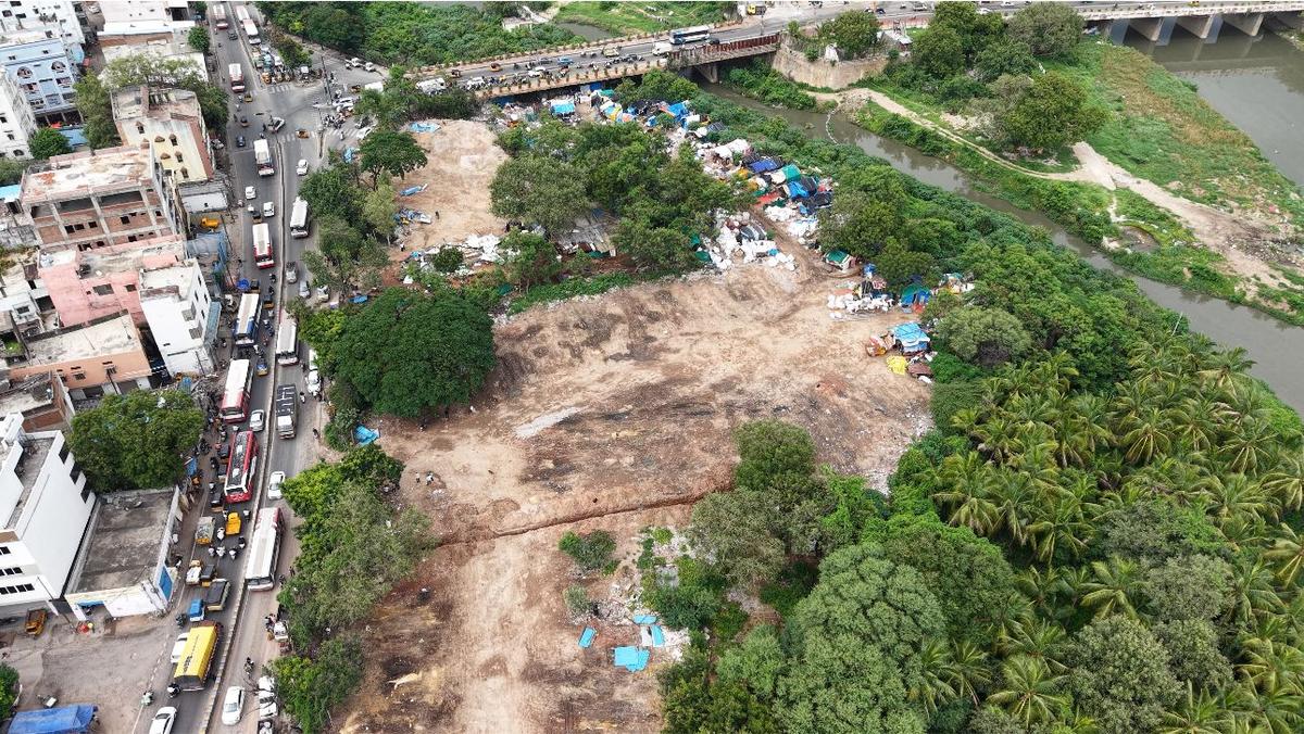 The encroached Musi river bed in Hyderabad was being used as parking for heavy vehicles including district buses. The encroached Musi river bed in Hyderabad was being used as parking for heavy vehicles including district buses.