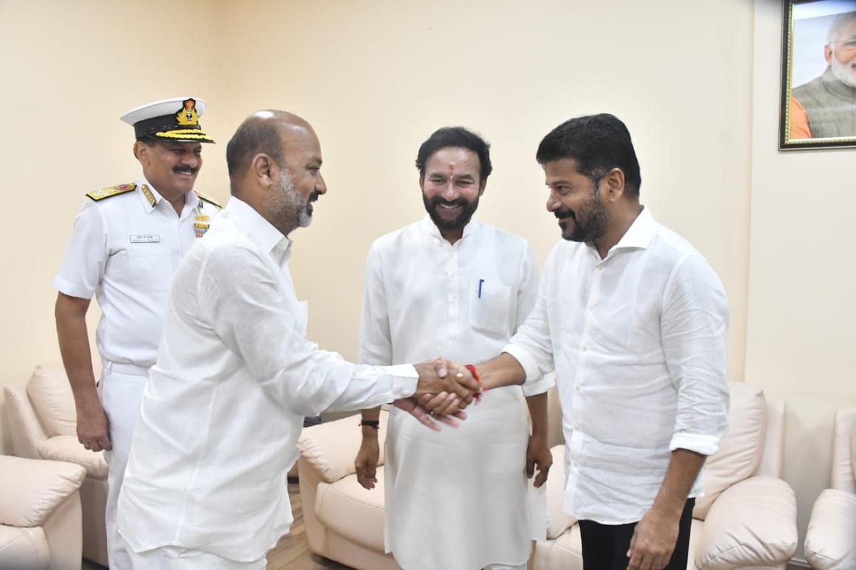 Telangana Chief Minister A. Revanth Reddy with Union Minister of State Bandi Sanjay Kumar and Union Minister & Telangana BJP chief G. Kishan Reddy on Tuesday. Telangana Chief Minister A. Revanth Reddy with Union Minister of State Bandi Sanjay Kumar and Union Minister & Telangana BJP chief G. Kishan Reddy on Tuesday.
