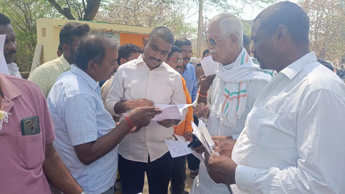 File photo of Dharani Committee members M. Kodanda Reddy and land laws expert M. Sunil Kumar interacting with farmers facing problems due to Dharani, as part of their field visit to understand the situation at grass root level. File photo of Dharani Committee members M. Kodanda Reddy and land laws expert M. Sunil Kumar interacting with farmers facing problems due to Dharani, as part of their field visit to understand the situation at grass root level.