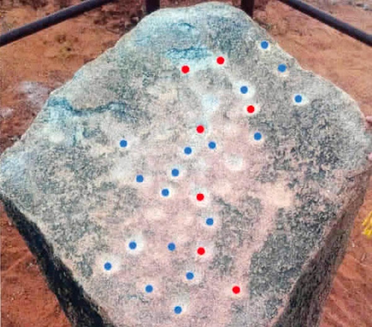 The constellation of Ursa Major (red dots) with surrounding stars (blue dots) on a boulder in Mudumal Naraynpet of Telangana