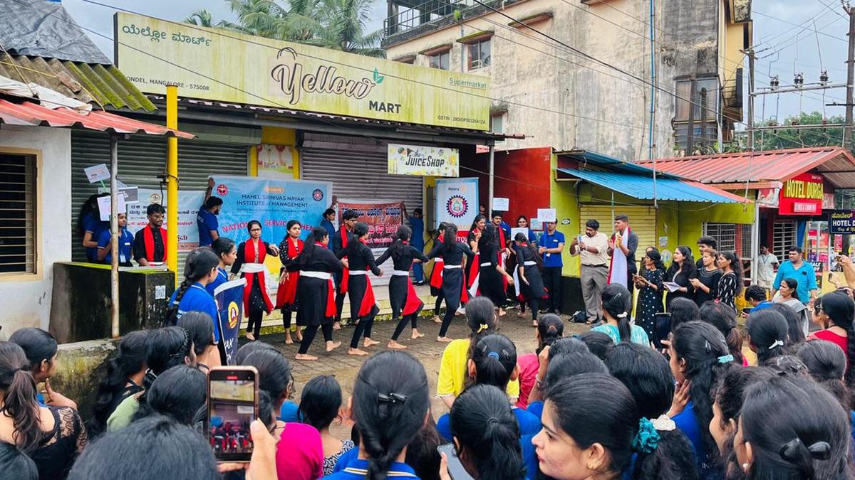 Students perform street theatre and pantomime to raise awareness of dengue fever