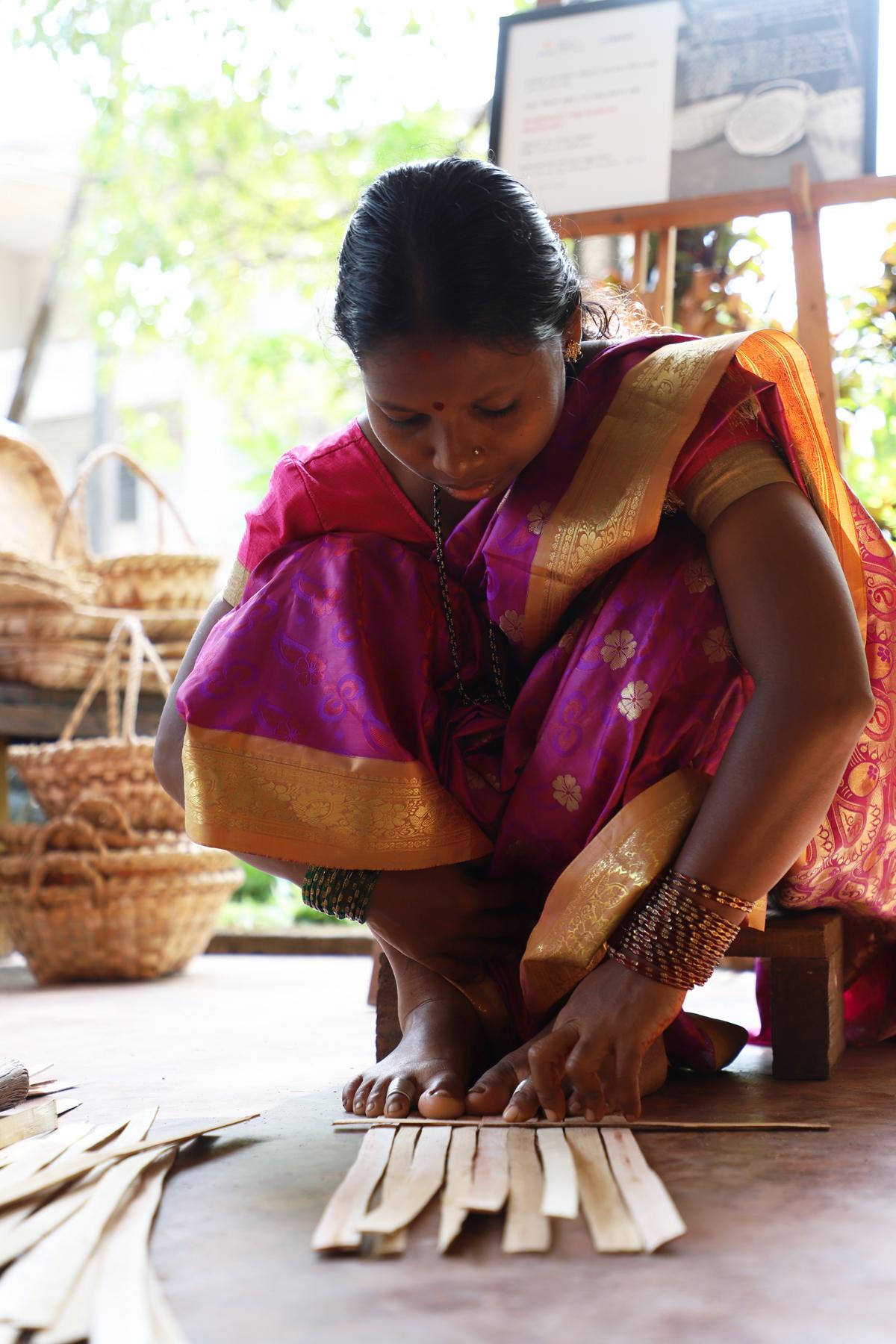 Ammi Korage Kadtala demonstrates during a workshop on basket weaving and Kadegolu making in Mangaluru on November 23, 2025.