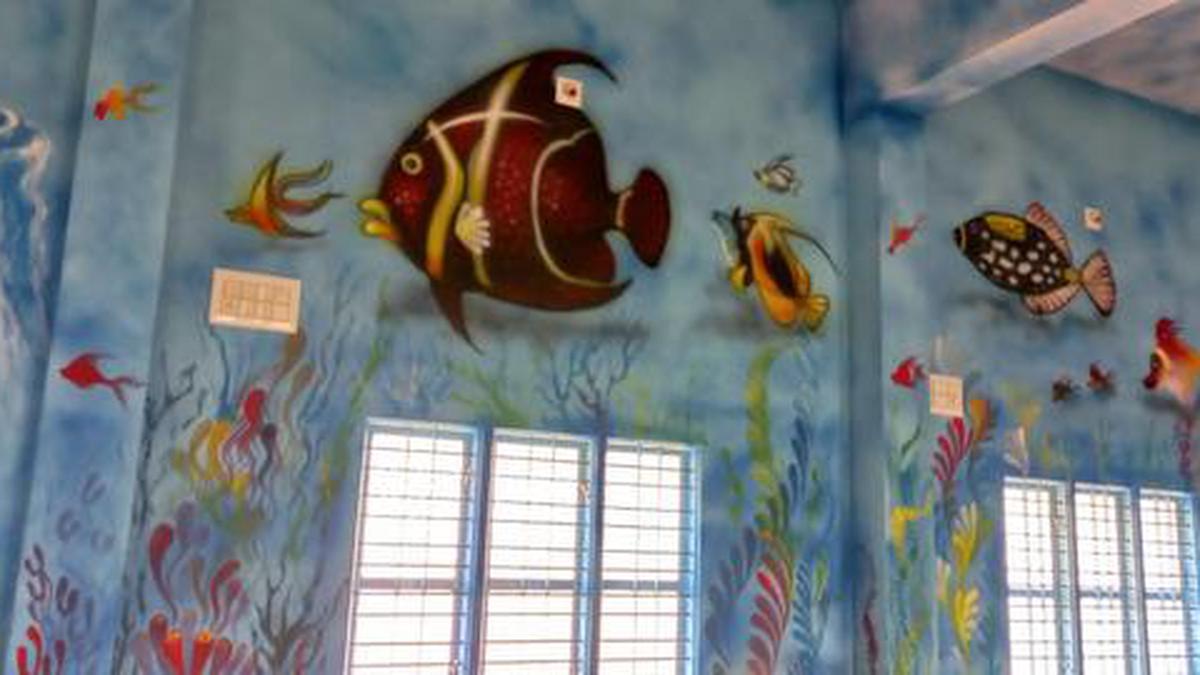 Drawing teacher turns walls of school into canvas