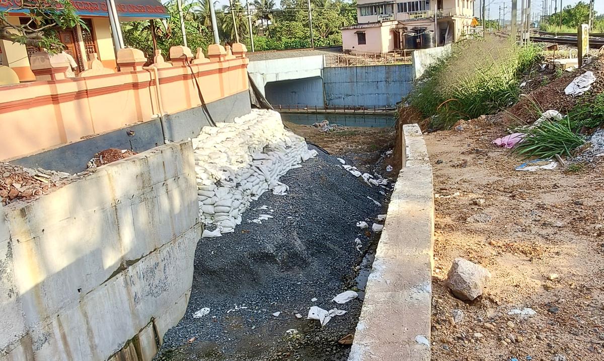 The Mahakalipadpu-Jeppu approach road, connecting the twin railway underbridge between two railway lines near Adi Maheshwari Temple, is yet to be completed at Mahakalipadpu in Mangaluru as of Monday. The Mahakalipadpu-Jeppu approach road, connecting the twin railway underbridge between two railway lines near Adi Maheshwari Temple, is yet to be completed at Mahakalipadpu in Mangaluru as of Monday.