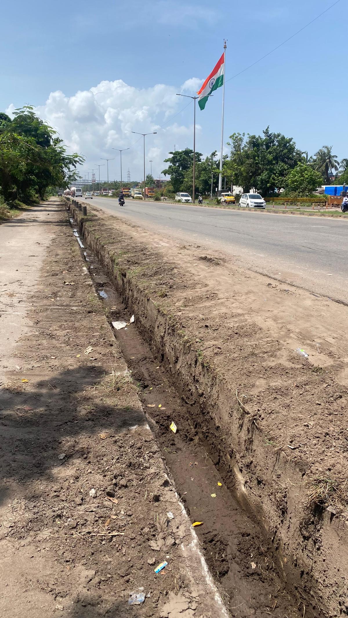 Shoulder drains on the flanks of Kochi-Panvel National Highway 66, part of Surathkal-B C Roat Port Connectivity Road, were cleared by the National Highways Authority of India as a part of total renewal work of the Port Road on June 7, Saturday, near New Mangalore Port in Mangaluru. Shoulder drains on the flanks of Kochi-Panvel National Highway 66, part of Surathkal-B C Roat Port Connectivity Road, were cleared by the National Highways Authority of India as a part of total renewal work of the Port Road on June 7, Saturday, near New Mangalore Port in Mangaluru.