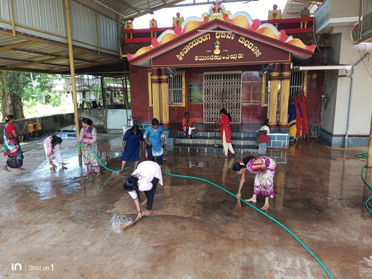 Volunteers under the banner of Sri Kshetra Dharmasthala Rural Development Project (SKDRDP) cleaned the premises of Panduranga Bhajana Mandira in Elluru village during the “Namma Ooru, Namma Shraddha Kendra” Independence Day cleanliness campaign in Udupi district recently. Volunteers under the banner of Sri Kshetra Dharmasthala Rural Development Project (SKDRDP) cleaned the premises of Panduranga Bhajana Mandira in Elluru village during the “Namma Ooru, Namma Shraddha Kendra” Independence Day cleanliness campaign in Udupi district recently.