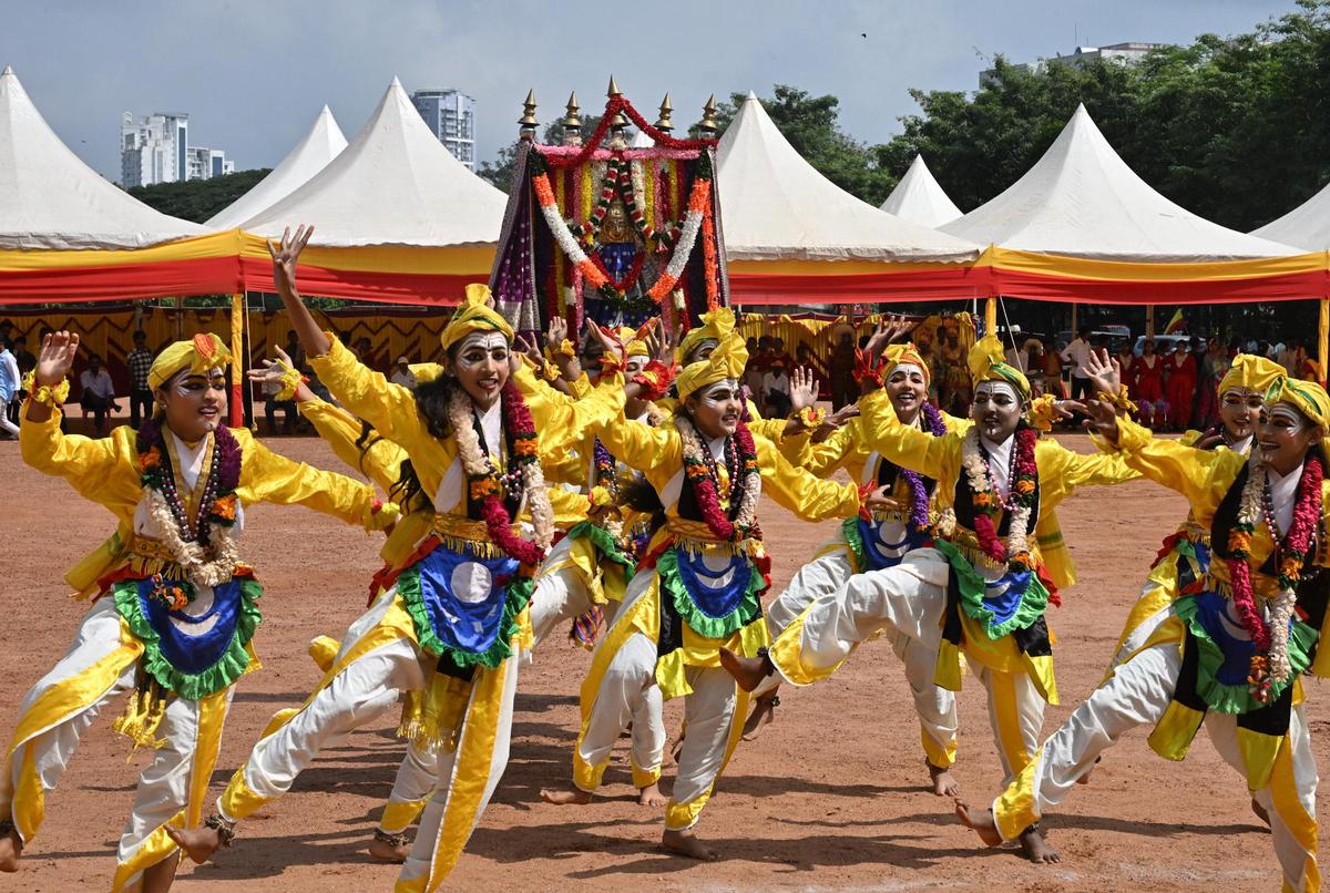 Students of Berthand Russel school performing traditional dance during the cultural programme held at the District level Rajyotsava programme in Nehru Maidan in Mangaluru on Saturday