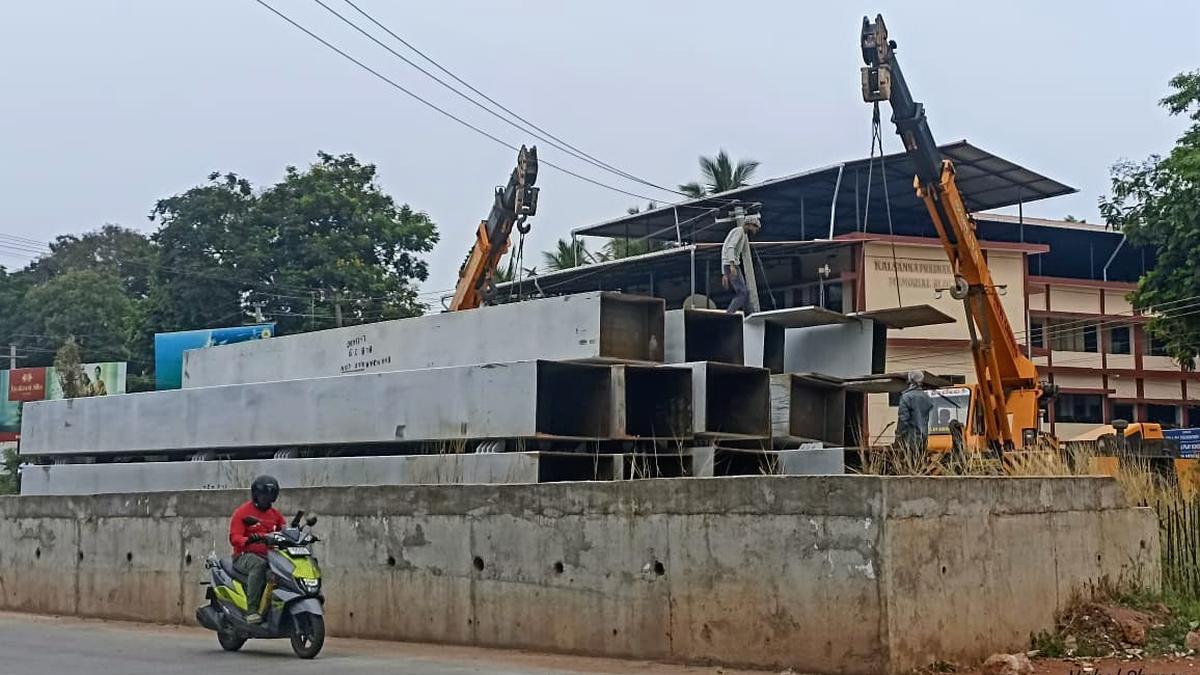 Work of assembling prefabricated bowstring steel bridge over railway line begins at Indrali in Udupi