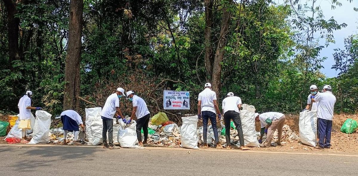 Volunteers under the banner Hasiru Tapasvi, Belthangady, including students of Vivekananda College, Mundaje, cleared tonnes of plastic trash dumped by devotees who came by Padayaatra to Dharmasthala on the eve of Maha Shivaratri via Charmadi Ghat on Thursday, March 14. 