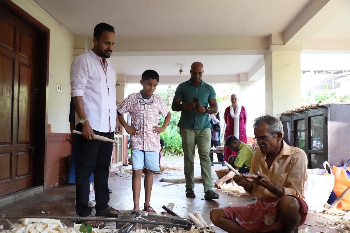 Traditional artisans demonstrate making of bamboo basket and Kadegolu at a workshop on basket weaving and Kadegolu making organised to mark the World Heritage Week organised by INTACH Mangaluru and Art Kanara Trust in Mangaluru on November 23, 2025.