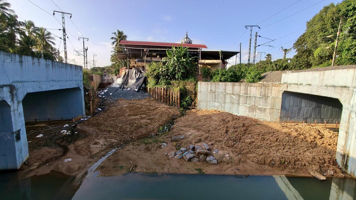 The approach road for residents of Mahakalipadpu-Jeppu, connecting the twin railway underbridge between two Railway lines near Adi Maheshwari Temple, is yet to be completed at Mahakalipadpu in Mangaluru as of Monday. The approach road for residents of Mahakalipadpu-Jeppu, connecting the twin railway underbridge between two Railway lines near Adi Maheshwari Temple, is yet to be completed at Mahakalipadpu in Mangaluru as of Monday.