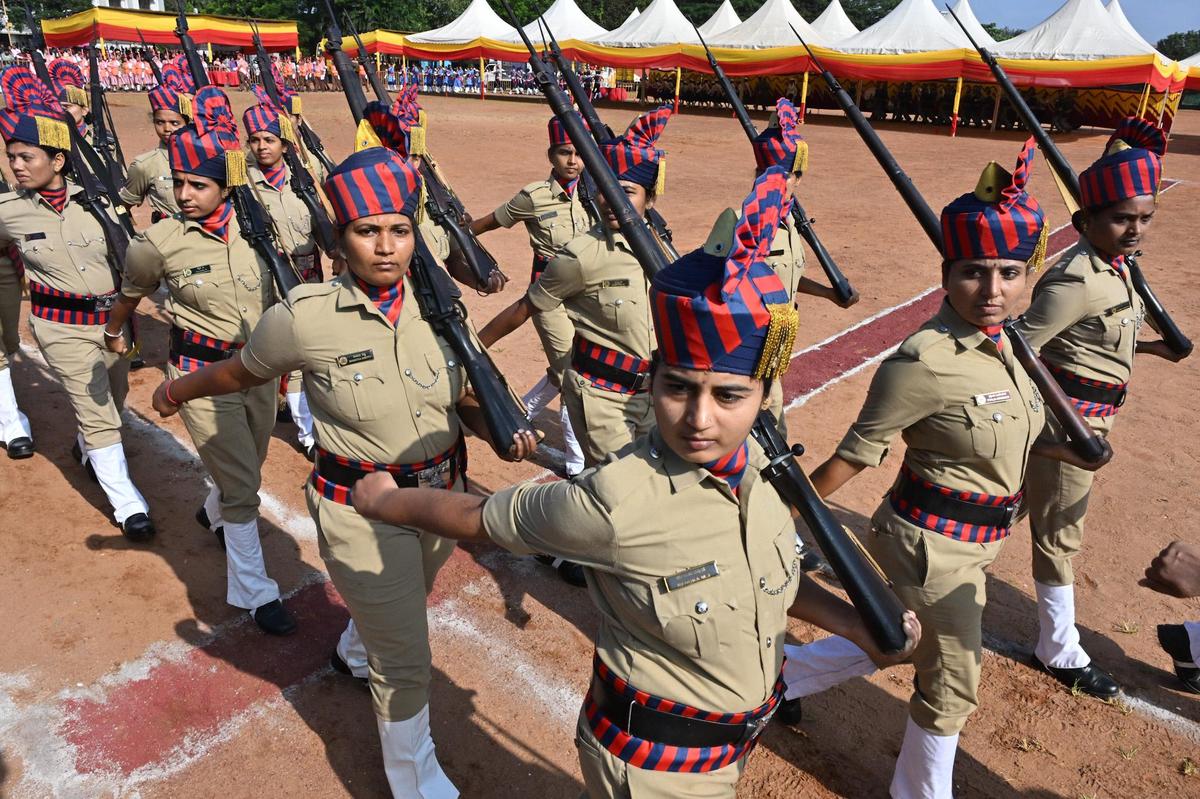 A team of women police that took part in the march past during the district-level Rajyotsava celebrations at Nehru Maidan in Mangaluru on Saturday