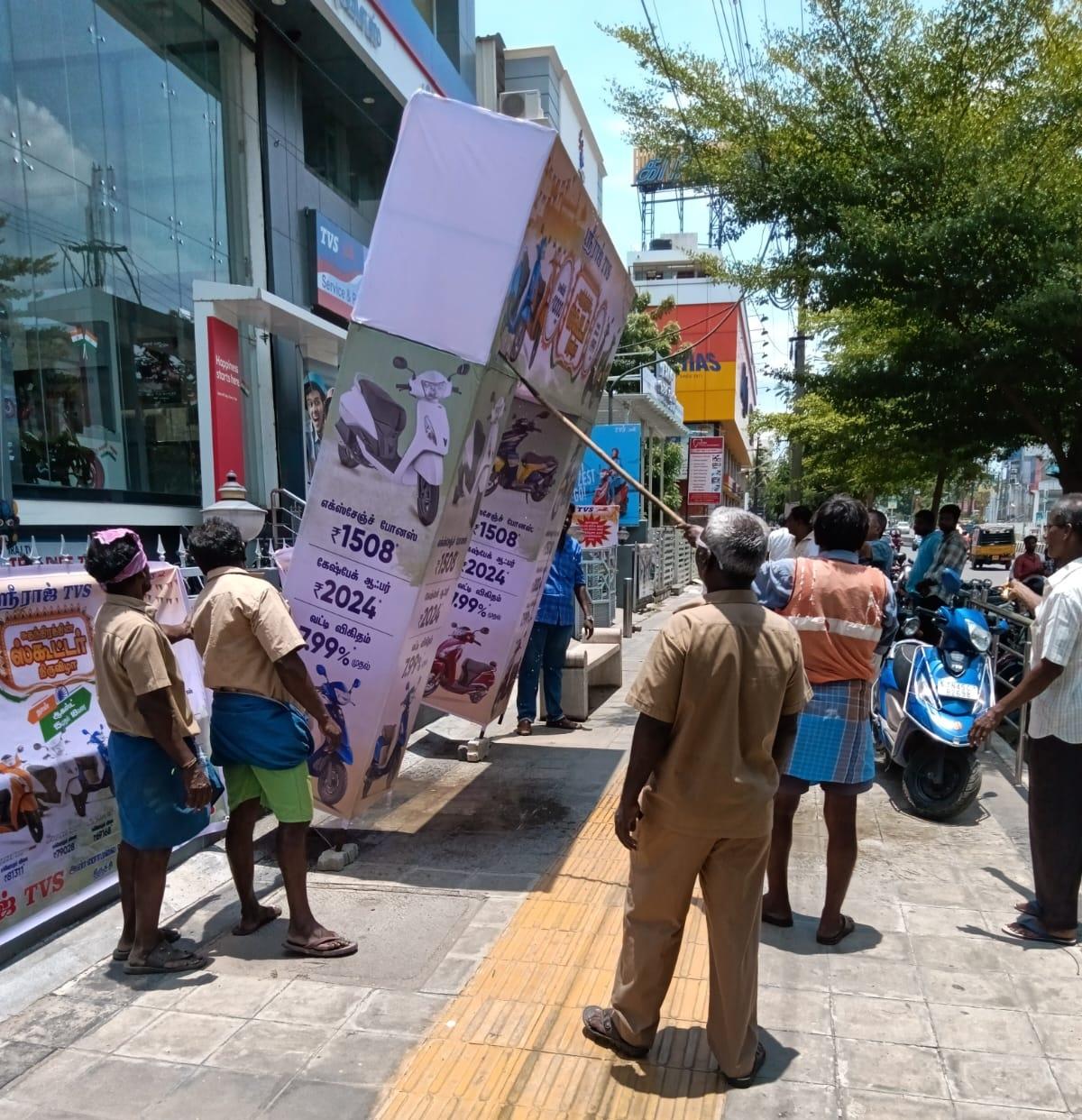 Billboards are being removed from pedestrian platforms on Karur Bypass Road in Tiruchi.