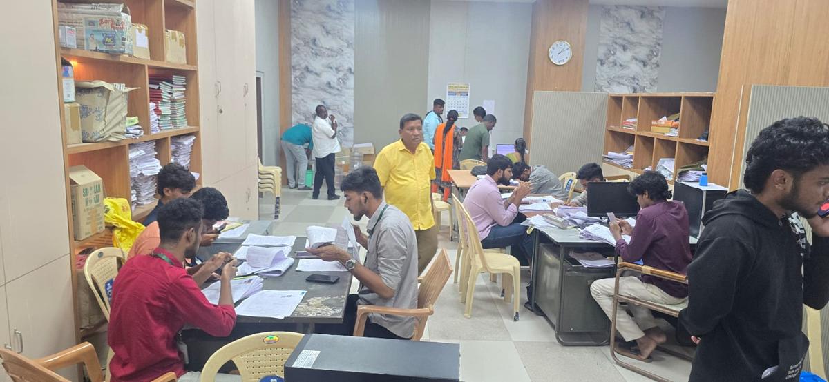Personnel engaged in uploading data of electors in Tiruchi East Assembly constituency.