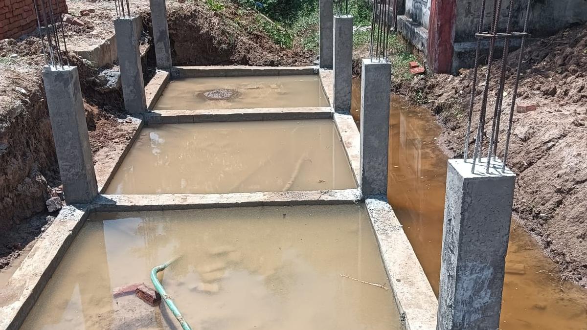 Construction of bus shelter over water course objected