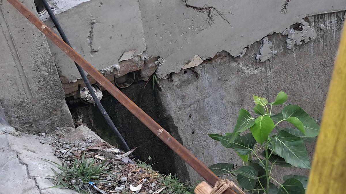 Retaining wall of canal near Erukkancheri High Road in Vyasarpadi under Tondiarpet zone being broken for illegal sewage outlet. Retaining wall of canal near Erukkancheri High Road in Vyasarpadi under Tondiarpet zone being broken for illegal sewage outlet.