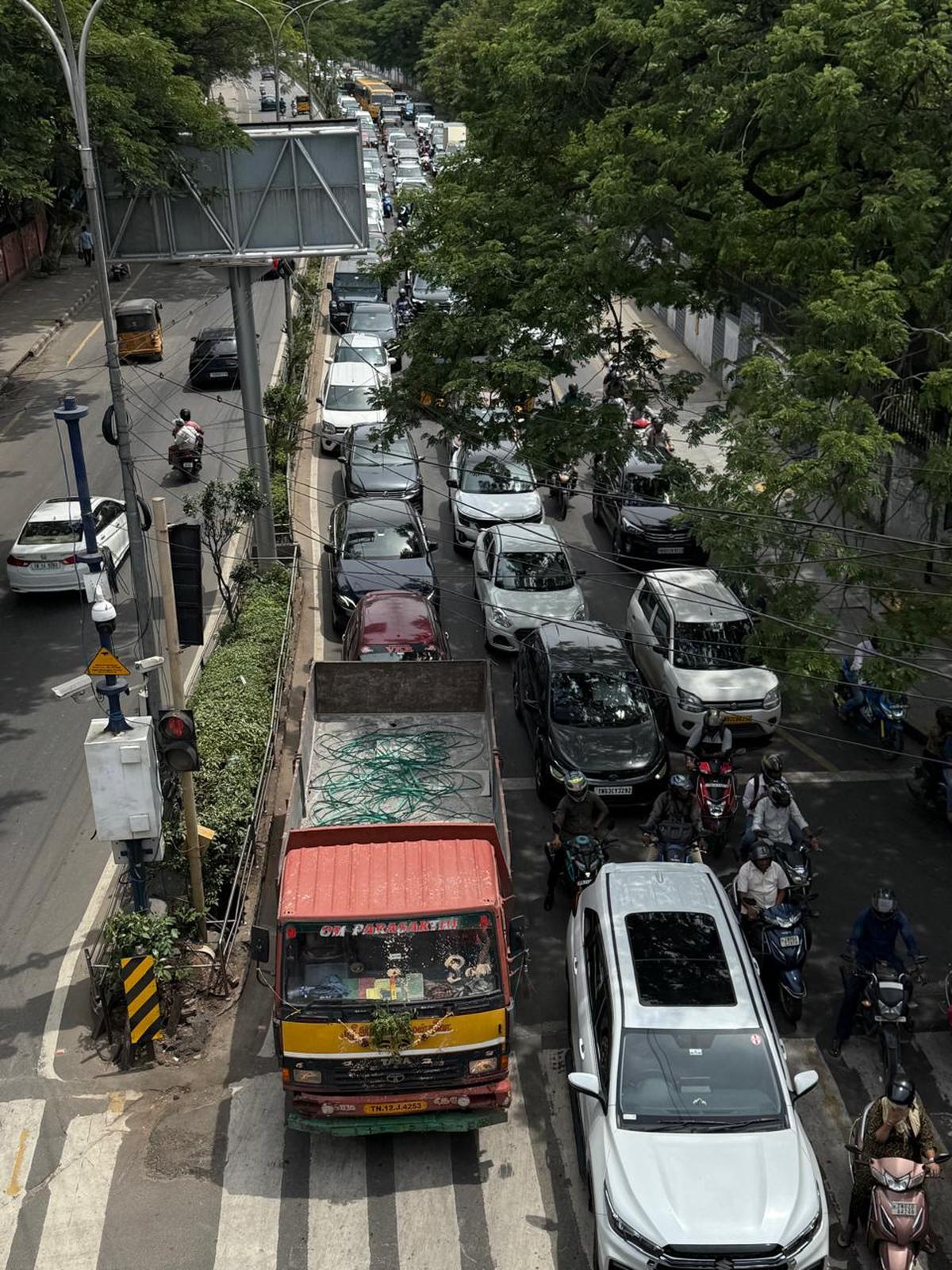 Traffic snarls at Kotturpuram Road near Cancer Hospital junction as diversions and heavy vehicle movement lead to major congestion. Traffic snarls at Kotturpuram Road near Cancer Hospital junction as diversions and heavy vehicle movement lead to major congestion.