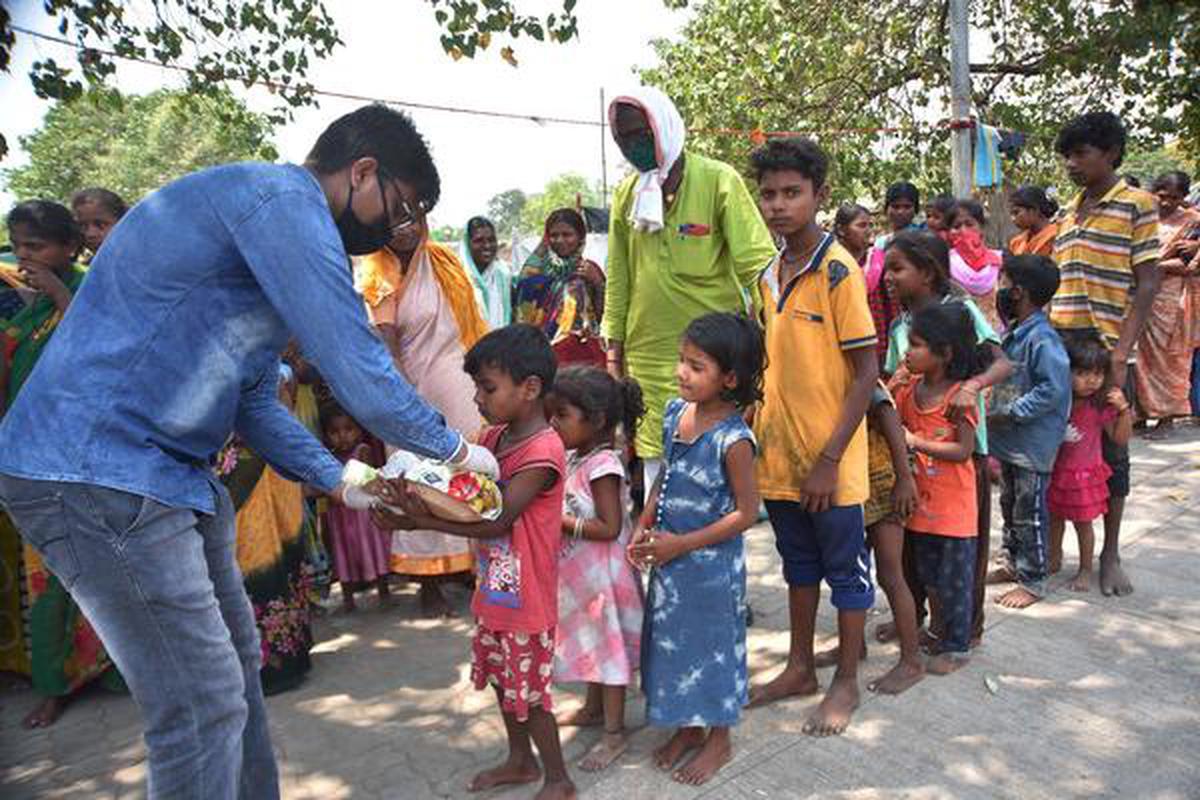 Helping india. Ngo worker. Underprivileged people. Feeding India.