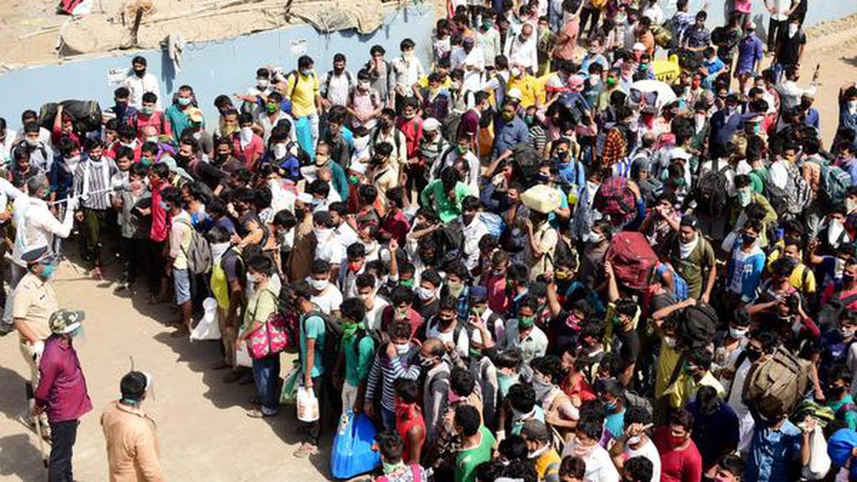 Thousands of migrants gather outside Bandra station in hope of catching ...