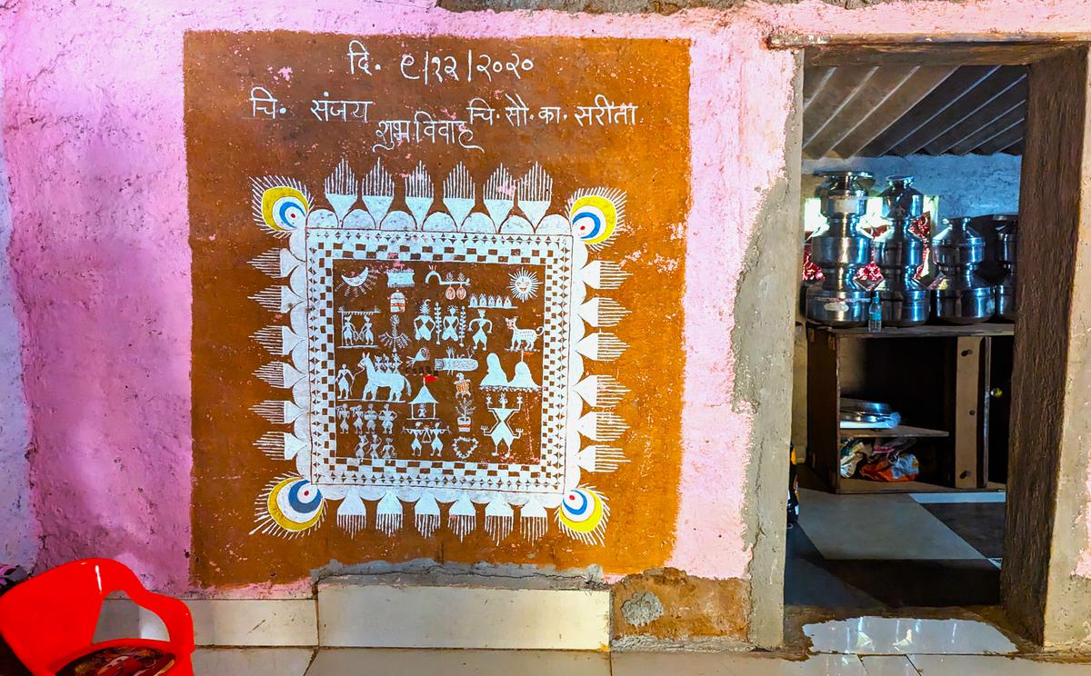 Warli painting inside a home of a family in Aarey forest. 