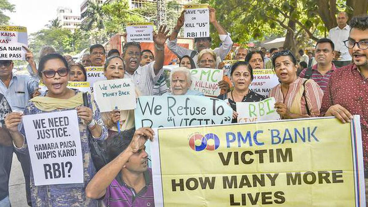 PMC Bank: two auditors held