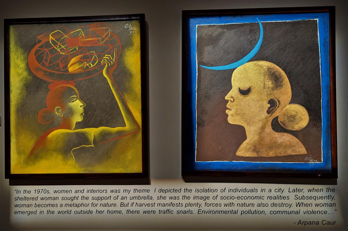 Arpana Caur’s composition, ‘Women hold up half the sky’ is depicting a woman with a blue crescent moon on her head that shows women in construction sites, where the heavy vessel on her head takes the shape of the moon.