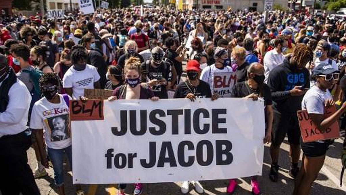 ’7 bullets, 7 days’: Protesters march for Jacob Blake in Kenosha