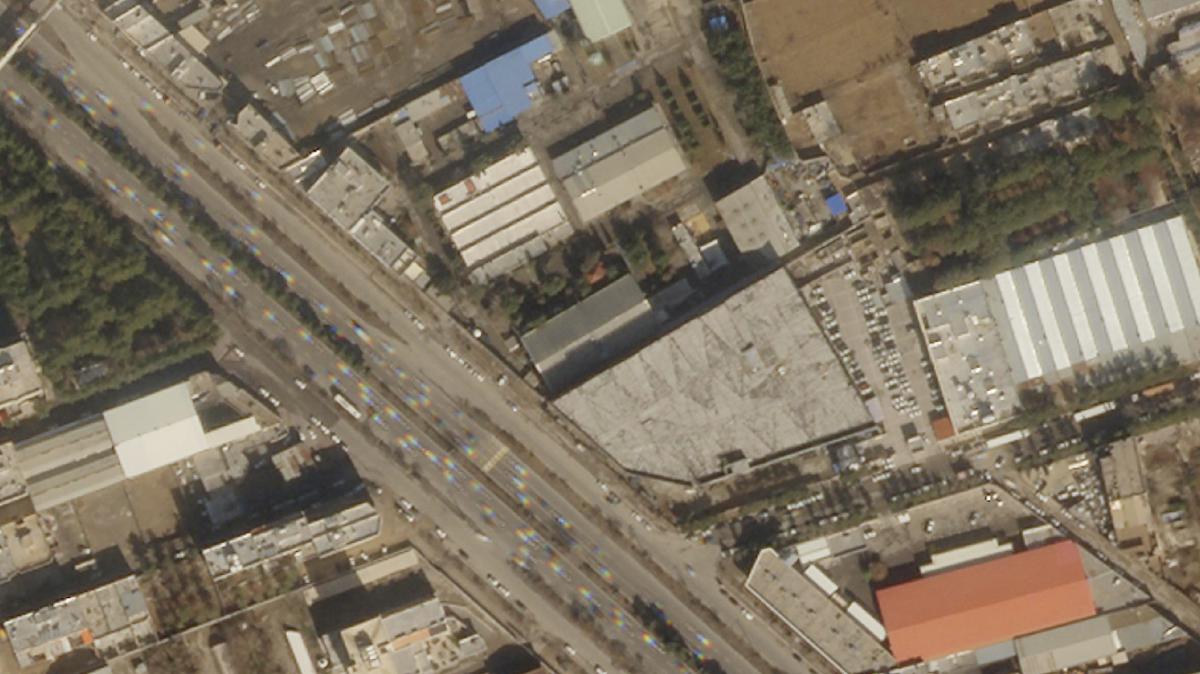 This satellite image from Planet Labs PBC shows damage on the roof of an Iranian military workshop.