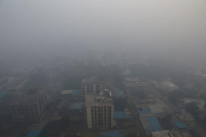 Residential buildings shrouded in smog in Noida, November, 2021.