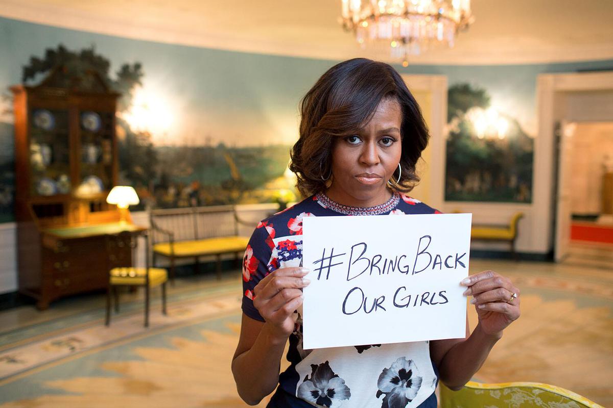 Michelle Obama with the campaign slogan, calling for the safe return of the Nigerian schoolgirls.