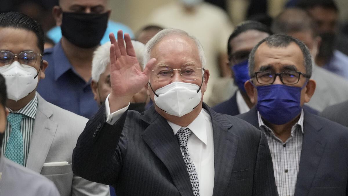 Malaysia halves prison term for former Prime Minister Najib Razak who oversaw multibillion-dollar 1MDB thefts