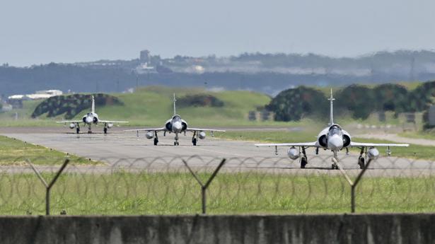 Chinese language fighter jets and warships crossed median line, says Taiwan