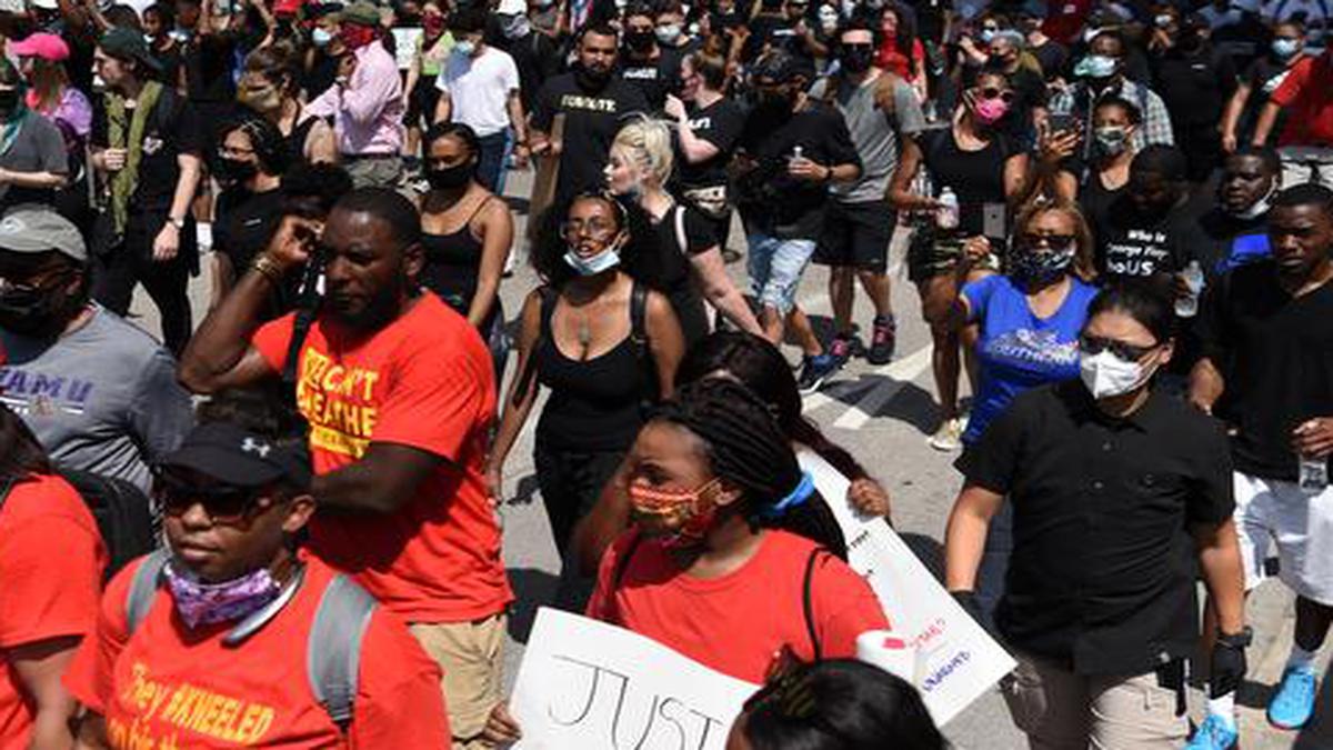 Thousands march in Houston to pay tribute to George Floyd