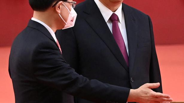 China's Xi swears in new Hong Kong leader John Lee