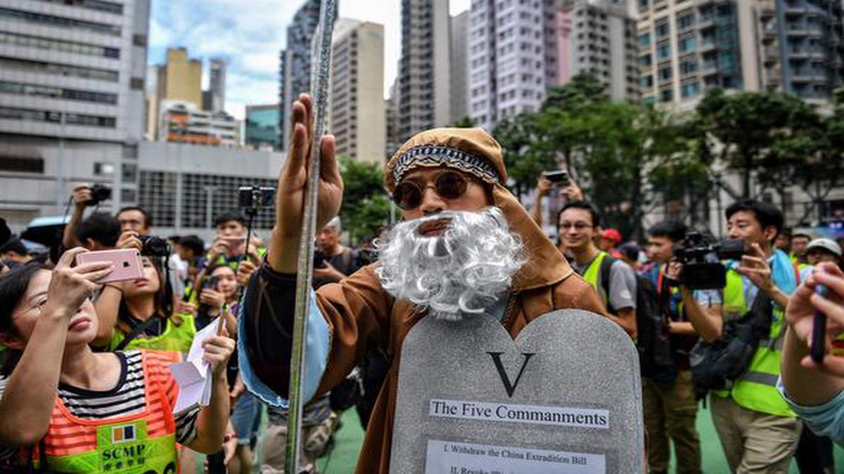 Hong Kong police fire tear gas as protesters hurl petrol bombs