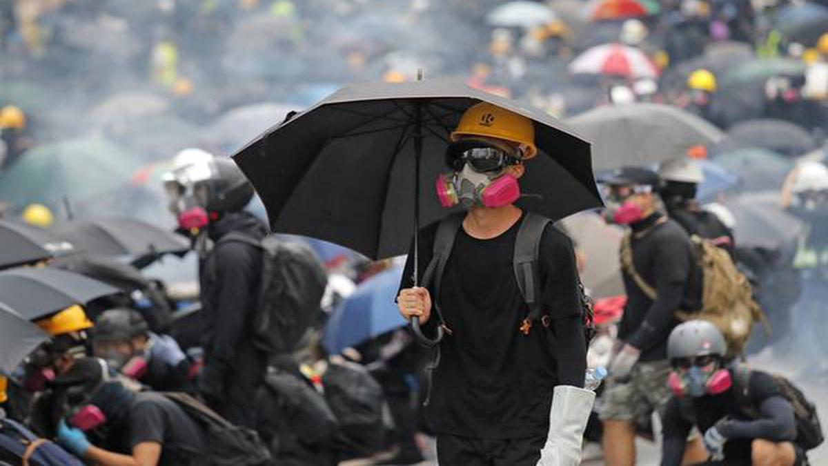 Hong Kong police storm subway with batons as protests rage