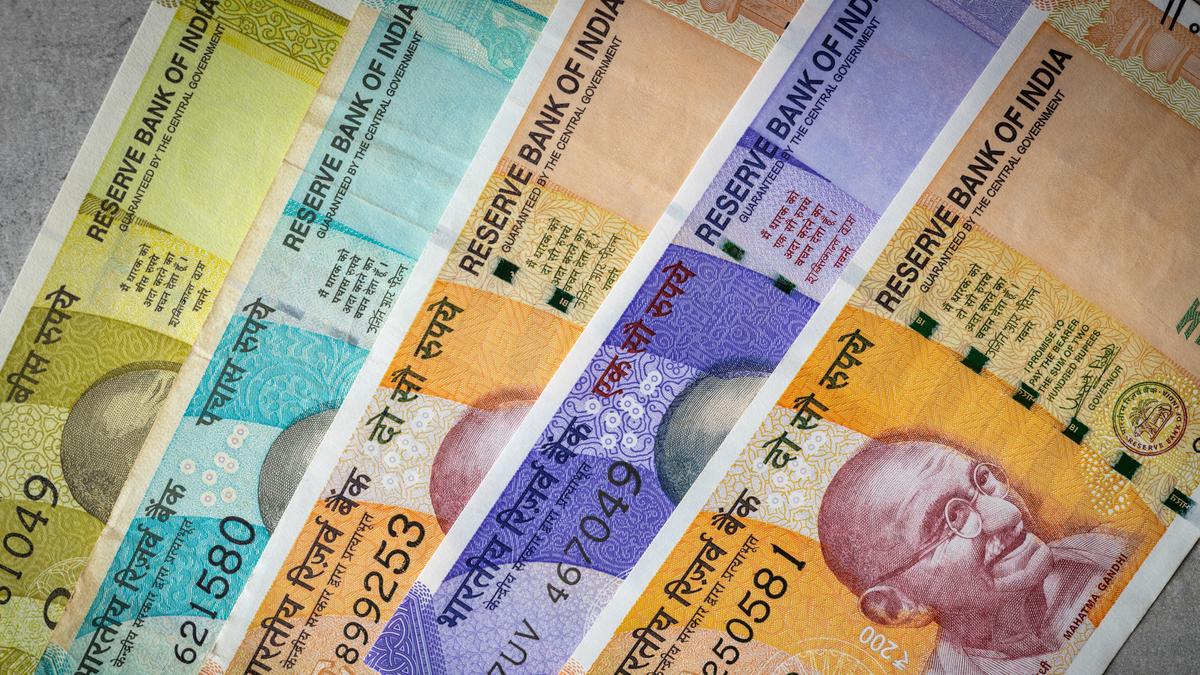 Rupee plummets 31 paise to settle at 90.99 against U.S. dollar