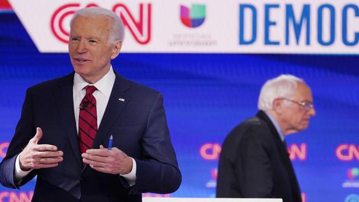 Three more Joe Biden victories increase pressure on Bernie Sanders to quit