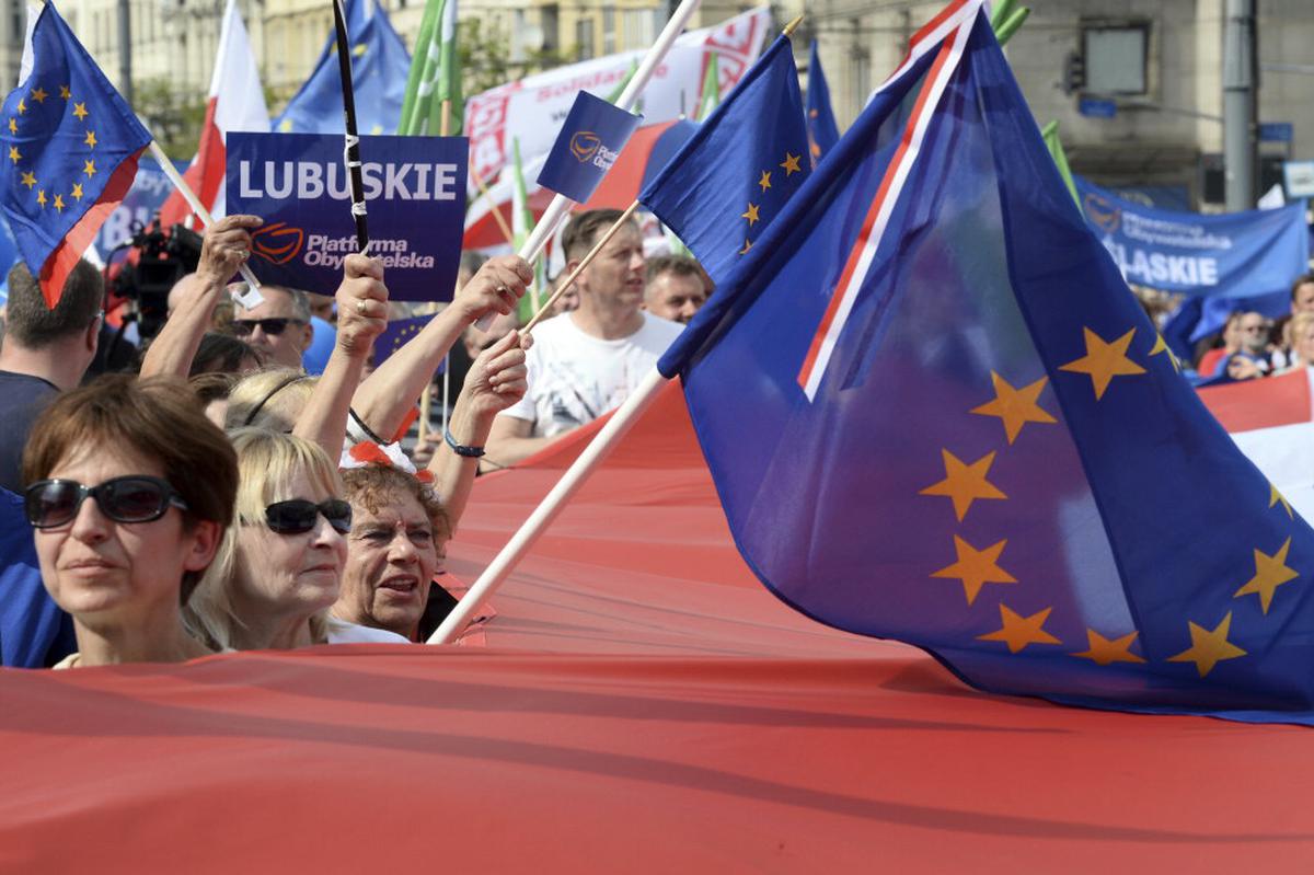 Protesters wave flags during the “Freedom March” in Warsaw, Poland, in June 2023