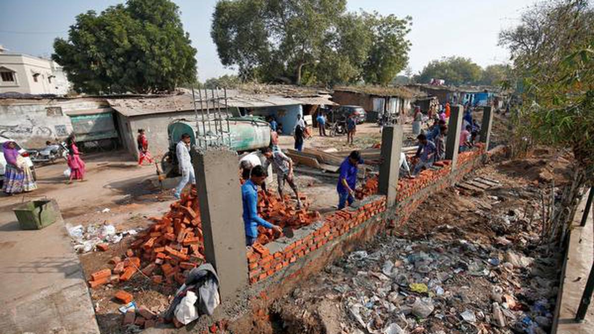 Walls rise in Ahmedabad ahead of Donald Trump visit