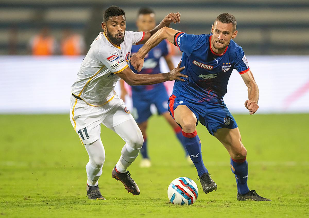 Suhair Vadakkepeedika (left) of East Bengal FC and Aleksander Jovanovic of Bengaluru FC vie for the ball during the Hero Indian Super League (ISL) 2022-23 football match between Bengaluru FC and East Bengal FC, at Sree Kanteerava Stadium in Bengaluru, Friday, Nov. 11, 2022. 