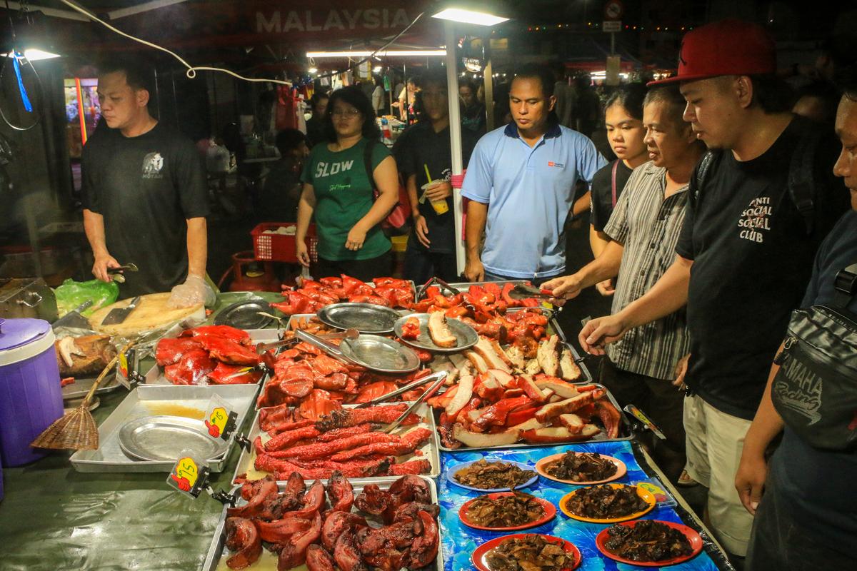 Cooked meat, mainly pork, is sold in the night makret in Sibu.