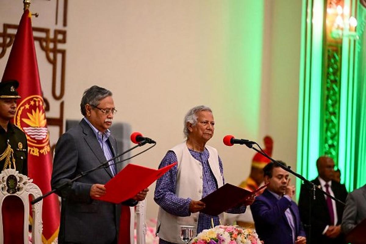 Nobel laureate Muhammad Yunus (C) is sworn in as the chief adviser of the new interim government of Bangladesh in Dhaka on August 8, 2024, as President Mohammed Shahabuddin (2L) administers the oath taking ceremony.