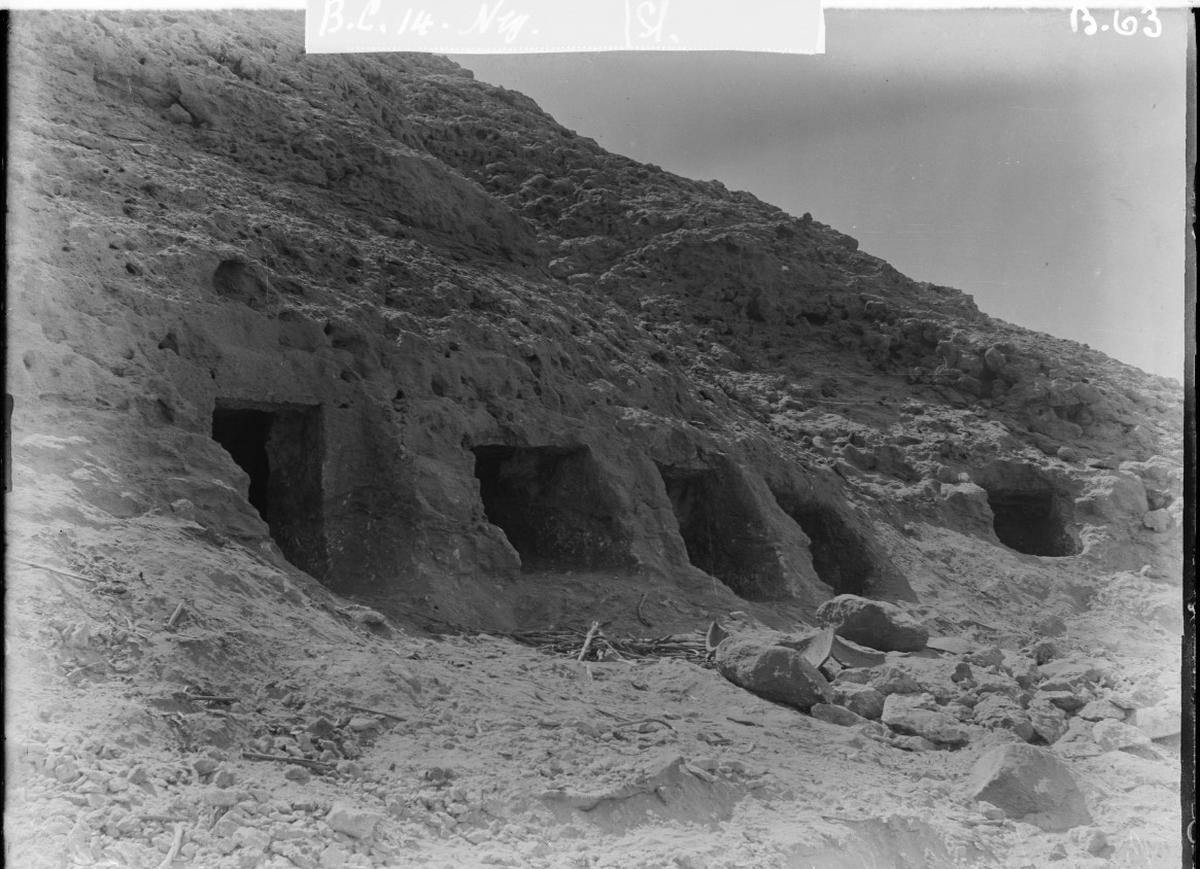 Rock-cut tombs at Nuwayrat enclosing the pottery vessel containing the pottery coffin burial. 