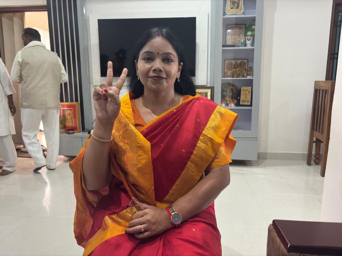 BJP candidate from Mohania assembly constituency Sangita Kumari at her village showing victory sign. 