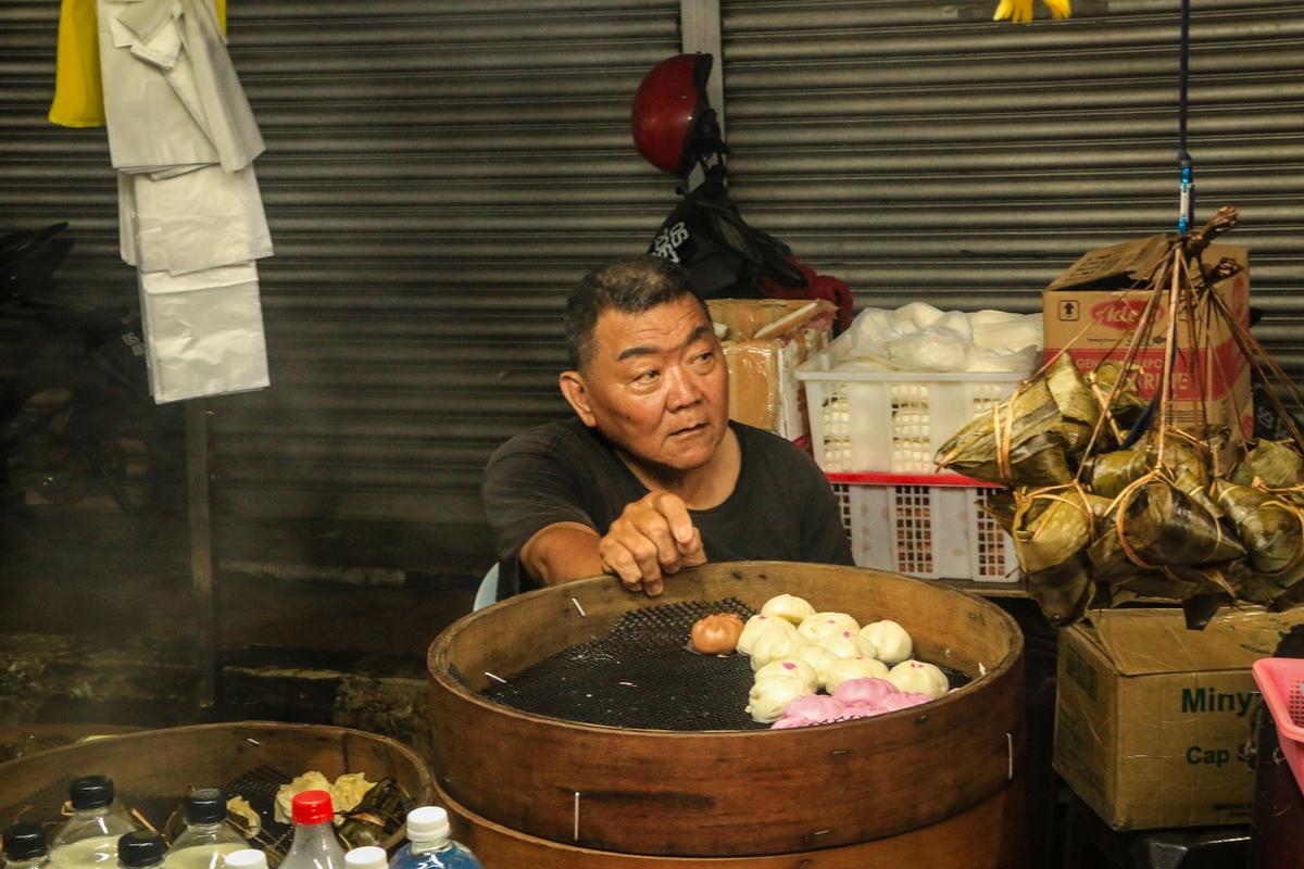 A vendor at the night market in Sibu selling dumplings.