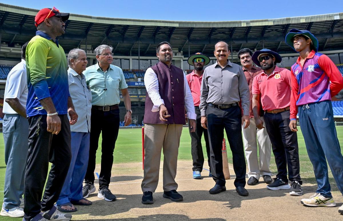 VMRDA Commissioner N. Tej Bharath at the ceremonial toss during the inauguration of the 28th edition of The Hindu FIC–AM/NS India Cricket Trophy at the ACA-VDCA Stadium in Visakhapatnam on Thursday. Sumit Bhattacharjee, Chief of Bureau, Andhra Pradesh, The Hindu, is also seen.
