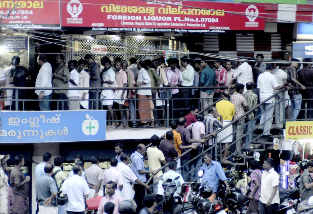Kerala has one of the highest alcohol consumption rates among major States. The photo shows people crowding a government-run liquor outlet. Kerala has one of the highest alcohol consumption rates among major States. The photo shows people crowding a government-run liquor outlet.