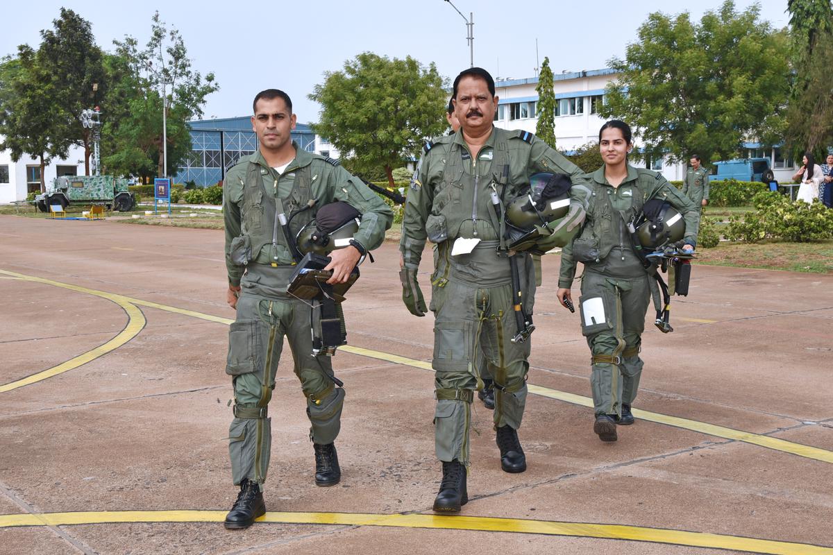Air Commodore Sanjay Sharma (middle), Flying Officer Ananya Sharma (right)